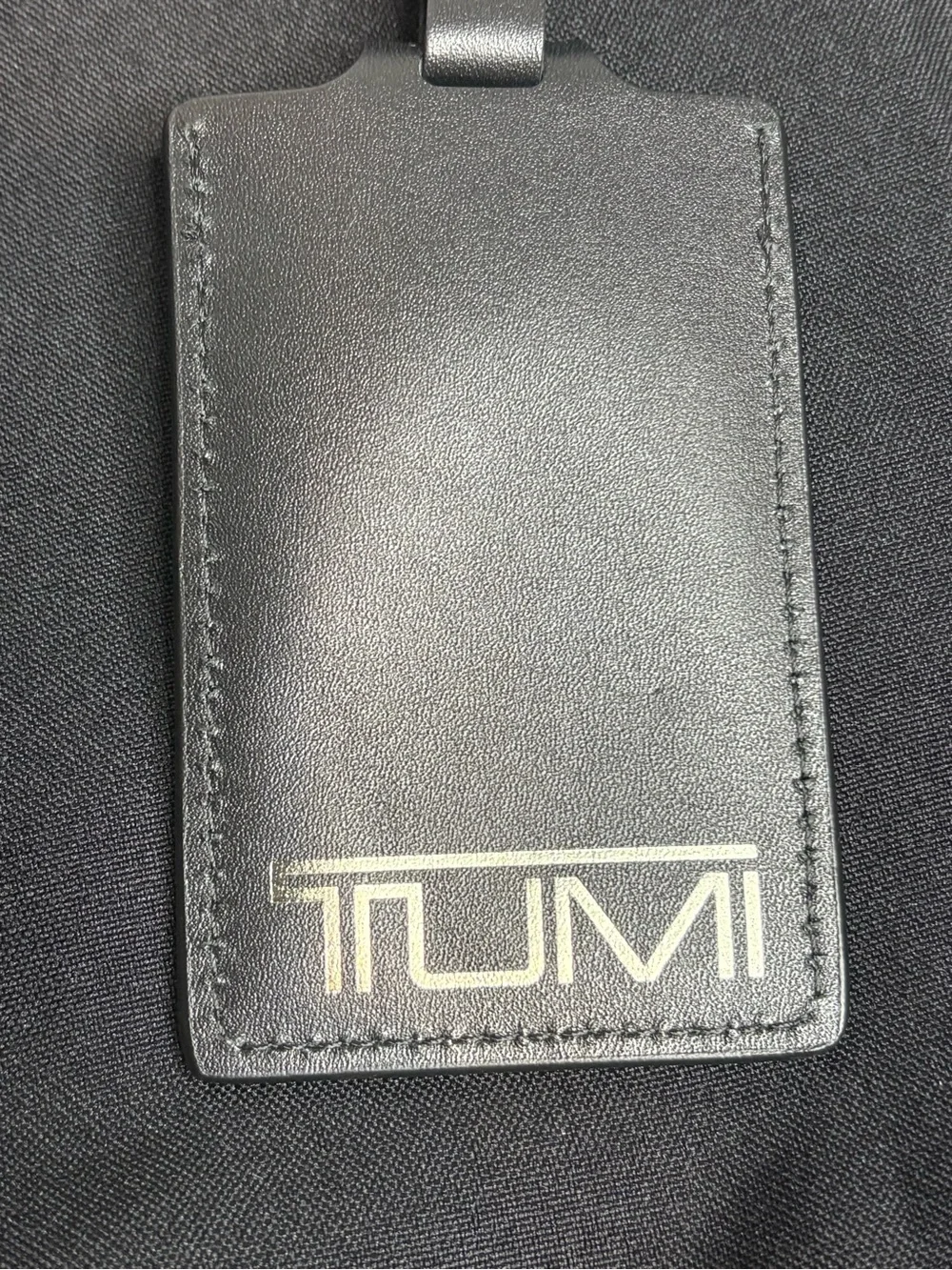 Tumi Black Travel Pouch with Pink Accents